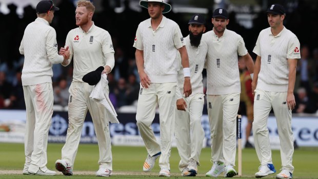 Ben Stokes gets a handshake from England's captain Joe Root, left, after taking his sixth wicket on the first day of the third test match earlier this month.