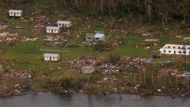 Debris is scattered around damaged buildings at Muamua on Vanua Blava Island in Fiji, after Cyclone Winston tore through the island nation.