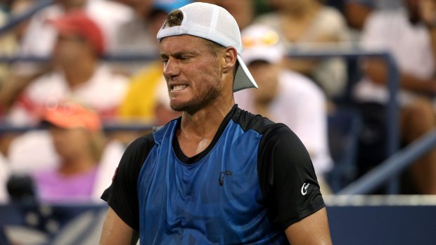 Feeling the heat: Lleyton Hewitt reacts during the match against Bernard Tomic.