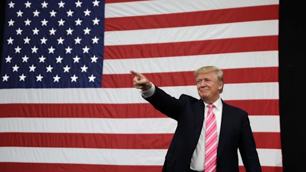 Republican presidential candidate Donald Trump takes the stage at a rally on Saturday in Manheim, Pennsylvania.