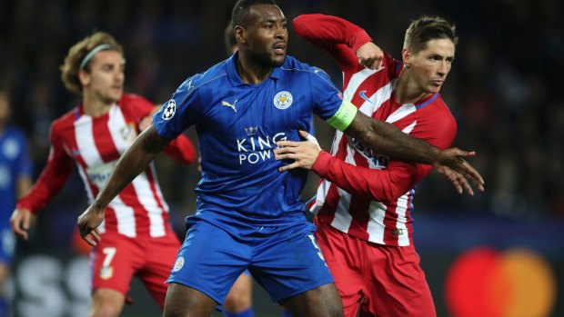 Fighting until the end: Wes Morgan tussles with Atletico Madrid's Fernando Torres.