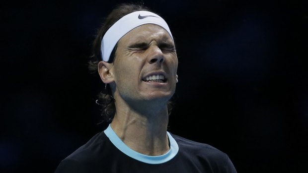 Feeling the strain: Rafael Nadal reacts after losing a point to Novak Djokovic.