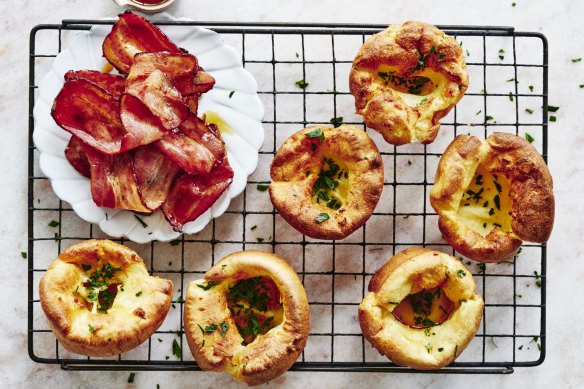 Mini Dutch babies with maple syrup and crispy bacon.