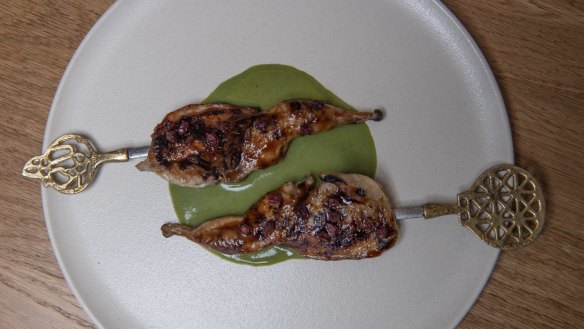 Quail skewers with barberry glaze and spinach-like molokhia.
