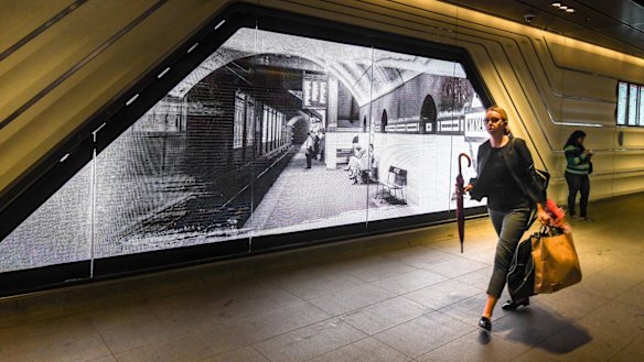 An electronic screen features archival photographs of Wynyard Station.