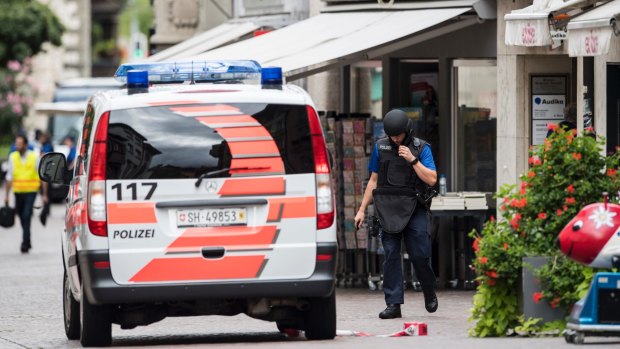 The police investigate in the old town of Schaffhausen in Switzerland during the manhunt.