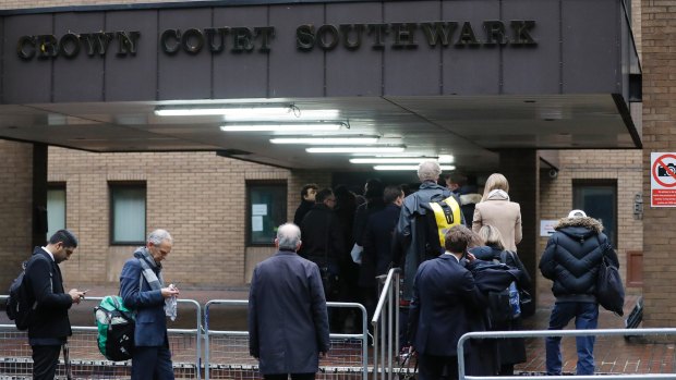 People queue to enter Southwark Crown Court in London, where the Rolf Harris trial is being held.