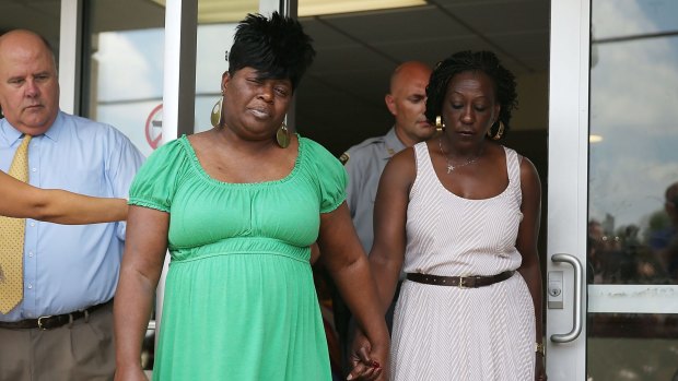 Nadine Collier (left) walks out of the Centralised Bond Hearing Court Preliminary Hearing Court after attending the bond hearing for Dylann Roof who is accused of killing her mother, Ethel Lance, and eight others during a shooting at the Emanuel African Methodist Episcopal Church.