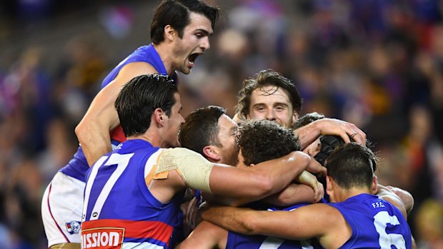 The Bulldogs celebrate their semi-final win at the MCG.