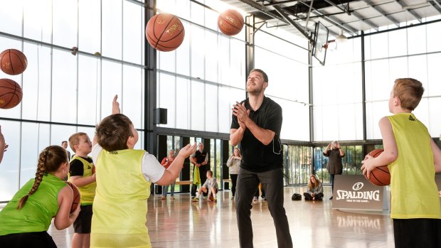 Dellavedova takes some  time out to conduct a children's clinic in Melbourne.