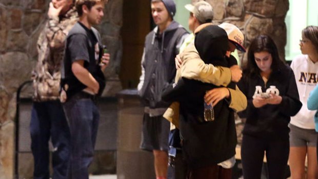 Students embrace outside a hospital emergency room in Flagstaff, Arizona after a campus shooting on Friday. 