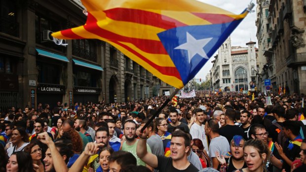Demonstrators with the independent Catalonia flag gather to protest in Barcelona.