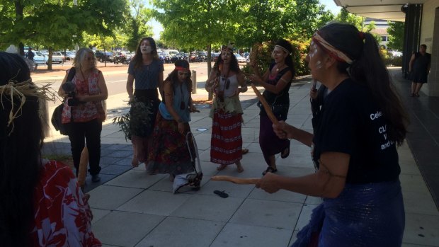 Indigenous activists protest outside the ACT Magistrates Court on Wednesday.
