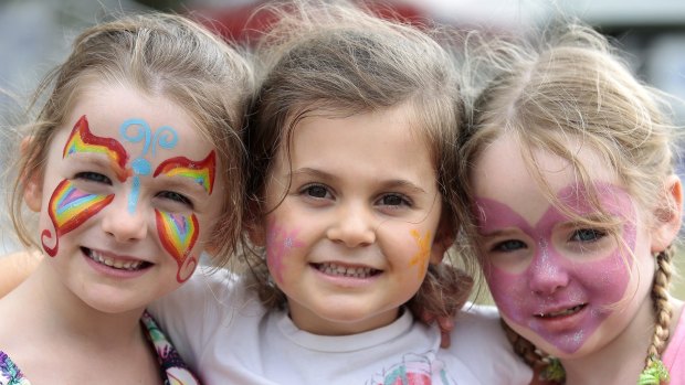 From left, Chloe Heycox, of Harrison, Lucinda Ovin, of Casey, and Zarah Heycox, of Harrison, each 4, had their faces painted at the show on Saturday. 