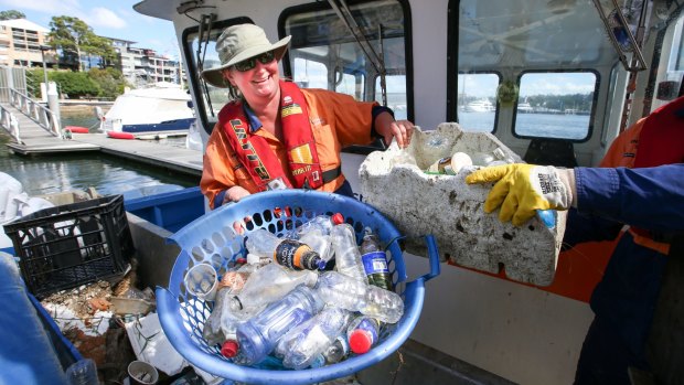 Clean Up Australia Day volunteers battle the bottle scourge in Sydney's waterways in March this year.