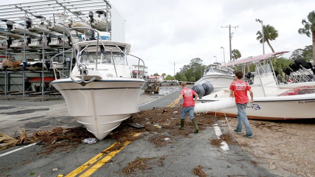 Debris and boats scattered across the road after Hurricane Hermine passed through Steinhatchee in Florida on Friday.