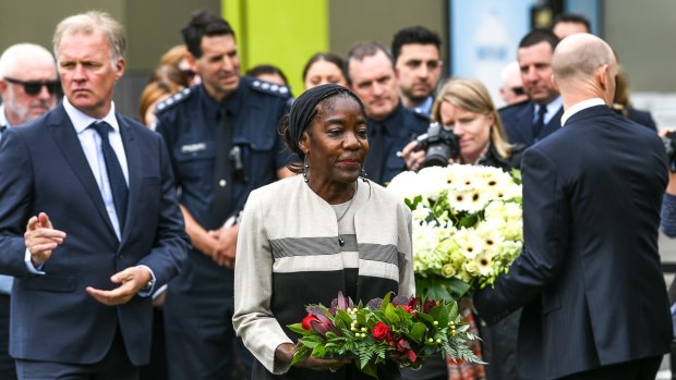 US Consul-General Frankie A. Reed lays a floral wreath at Essendon Airport. 