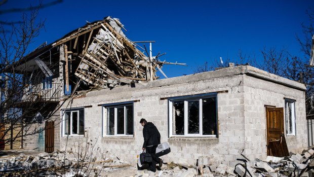 Cost of war: A home destroyed by shelling in Donetsk.
