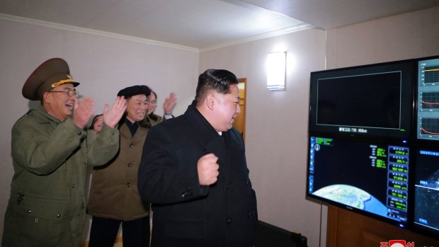 Unverified photos of North Korean leader Kim Jong Un celebrating after the intercontinental ballistic missile test.