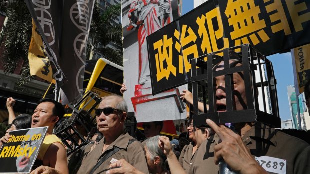 Protesters during a mass rally in Hong Kong on Sunday to support jailed activists Joshua Wong, Nathan Law and Alex Chow.