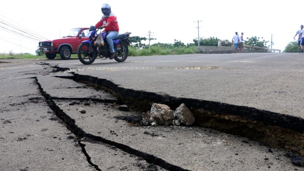 Cracks left in the road in Manta, Ecuador following Saturday's quake.