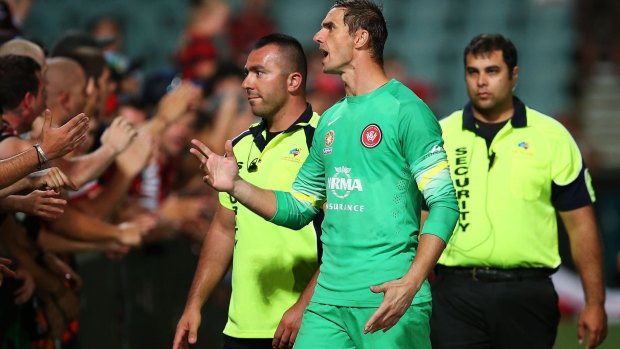 Show of support: Goalkeeper Ante Covic makes his point to the Wanderers faithful.