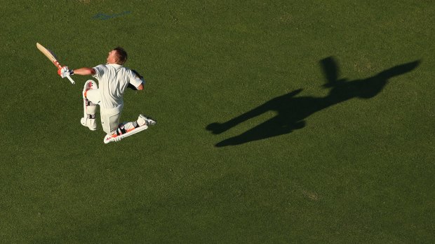 Oh, what a feeling: David Warner celebrates hitting the double-century mark in Perth.