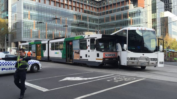 The tram and bus collided at the corner of La Trobe and William streets.