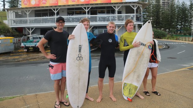 Surfing champion Mick Fanning with Starlight wish recipient Ben Beasley and his family.