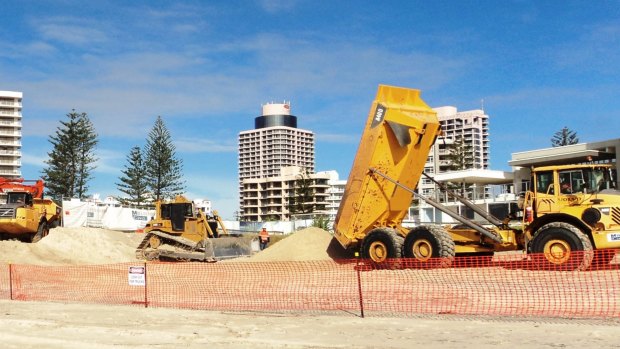 Bulldozers dump tonnes of cubic metres of sand to save Gold Coast beaches.