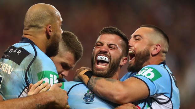 Sweet victory: NSW players celebrate during game one.