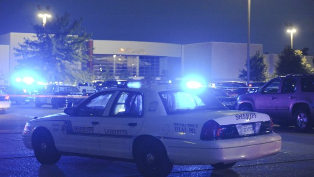 Police surround the Grand Theatre following a shooting in Lafayette, Louisiana.