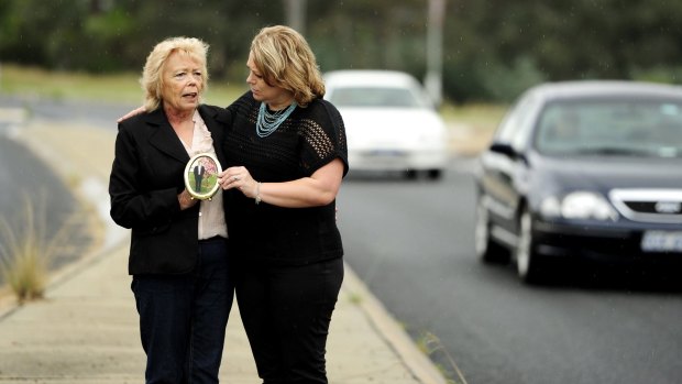 Troy's mother Valerie Tomkins, left, who died earlier this year, and sister Vanessa, right, at the scene of the hit-run.