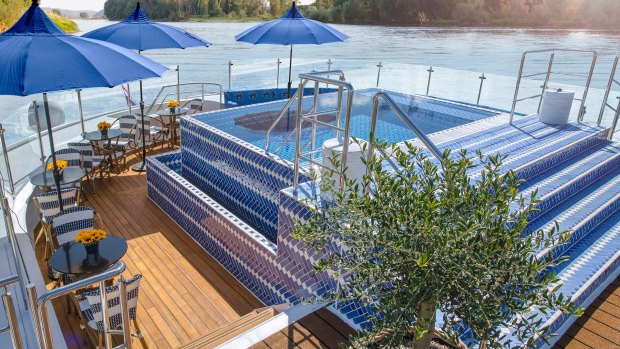 A sundeck and pool on Uniworld's Bon Voyage ship.