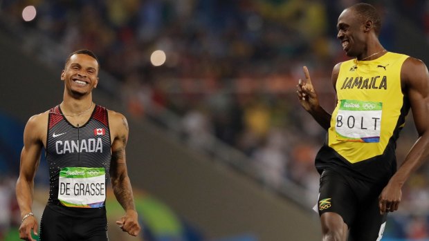 Usain Bolt wags his finger at Andre de Grasse after the men's 200-metre semifinal.