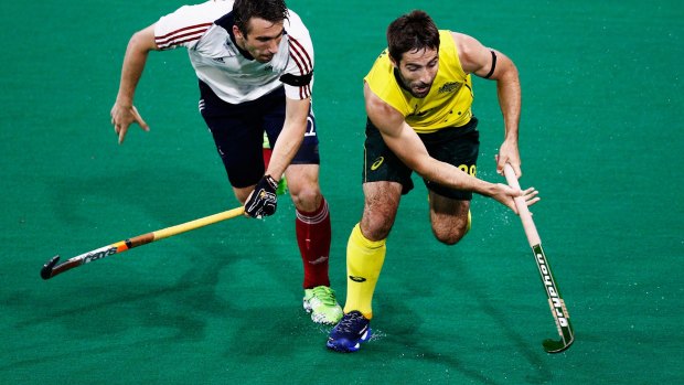 Kiel Brown of Australia battles for the ball with David Condon of Great Britain.