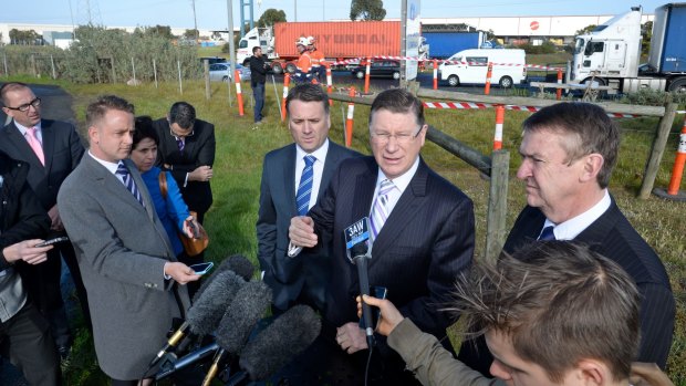 Former premier Denis Napthine, flanked by federal Infrastructure Minister Jamie Briggs and former transport minister Terry Mulder spruiking the East West Link.
