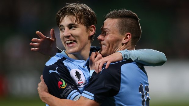Sky high: Riley Woodcock (right) congratulates Max Burgess after Burgess scored in the FFA Cup on Wednesday night.