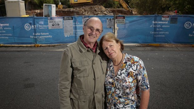 Ron and Wendy White in front of their former home in Chapman.  The Mr Fluffy home has been decontaminated and was demolished over the past week.   