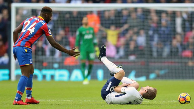 Tottenham's Harry Kane goes down after a Timothy Fosu-Mensah tackle for Palace.