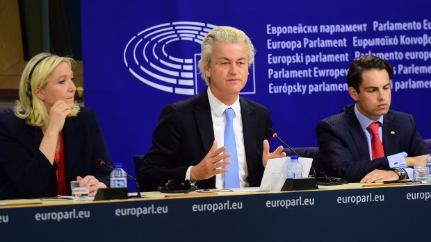 Geert Wilders (centre) of the Netherlands' Party for Freedom announces a new grouping of far-right parties at the European Parliament in Brussels with France's Marine Le Pen (left)  and Belgium's Tom van Grieken.