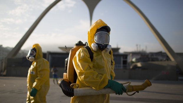 A health worker stands in the Sambadrome as he sprays insecticide to combat mosquitoes that transmit the Zika virus in Rio de Janeiro, Brazil.