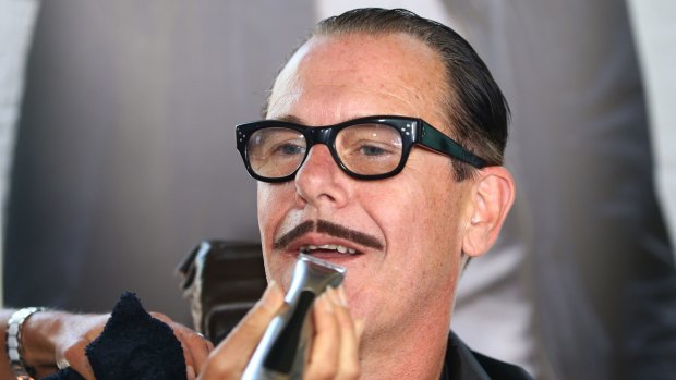 Kirk Pengilly of INXS took part in Movember, which is one of the charities contacted as part of an investigation into potential advertising fraud.