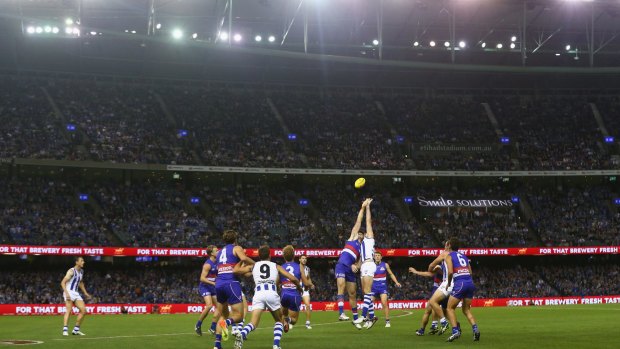 The Dogs and Roos battle at a packed Etihad Stadium on Friday night.