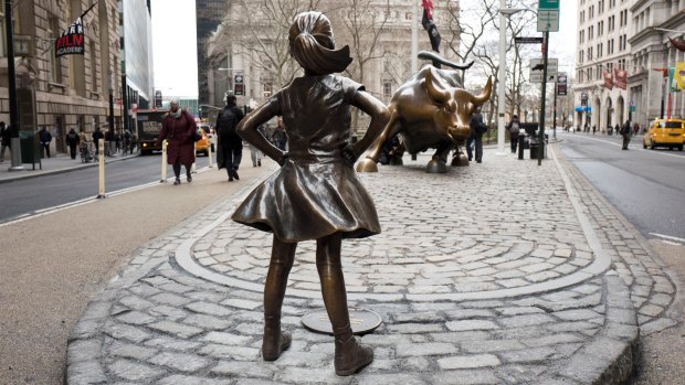 The "Fearless Girl" staring down the charging bull has become a favourite with tourists and will stay on Wall Street until 2018.