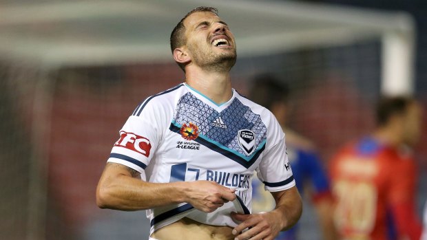 James Troisi of the Victory grimaces in pain during the game.