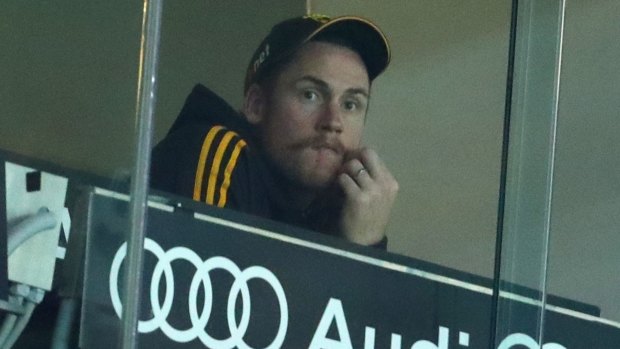 Hawthorn's Jarryd Roughead watches from the coaches' box during Friday night's game.