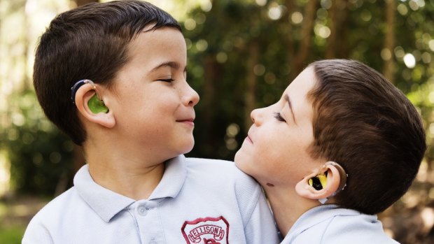 Hamish, seven, and his brother Angus, five. A teacher was the first to notice Hamish's hearing difficulties.