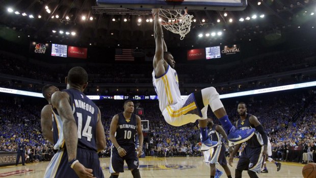 Slam dunk: Festus Ezeli adds two points for the Warriors.