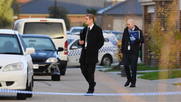 Police and forensic officers at the scene of the shooting in Church Road, Keysborough last month.